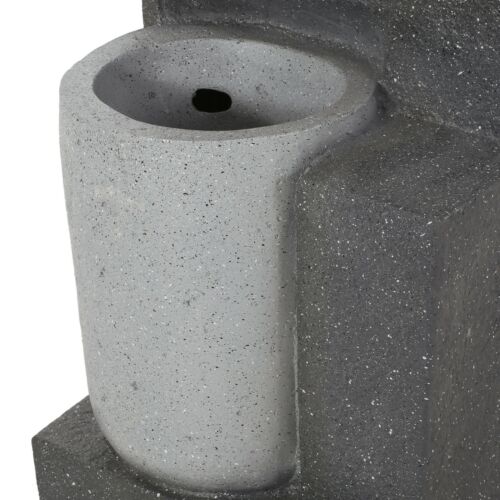 Contemporary concrete water fountain with minimalist design and smooth finish.