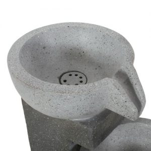 Contemporary concrete outdoor water fountain with a smooth, rounded design.